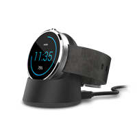 Moto 360 smartwatch charging on its wireless charging dock.